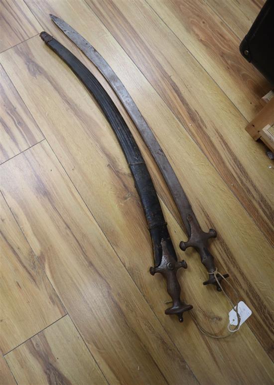 Two 19th century Indian talwar swords, one with scabbard, total length 83 and 88cm